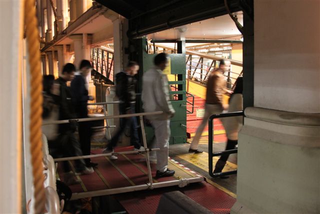 People Walking Off of Hong Kong Star Ferry