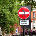 Travel Photo Thursday: London Street Signs After last week's admission that I love to take pictures of people taking pictures, I am following up with yet another confession. I love taking pictures of street signs. Sign pictures are like exposition in a movie. They tell the story without you having to tell the story. Maybe it's just lazy photography. Okay, I admit that it's just plain lazy photography but there are bright colours and professionally designed graphics. Street signs are like a photo sugar high to me.
